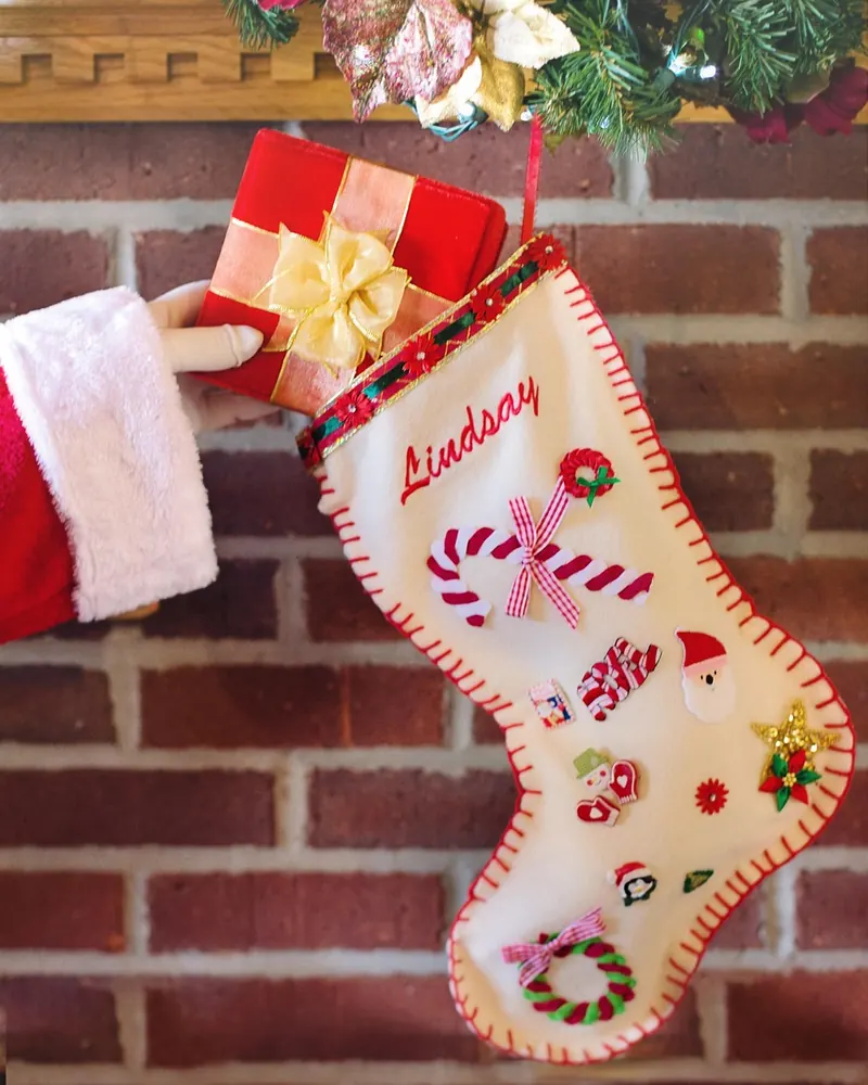 Santa's arm christmas stocking gift