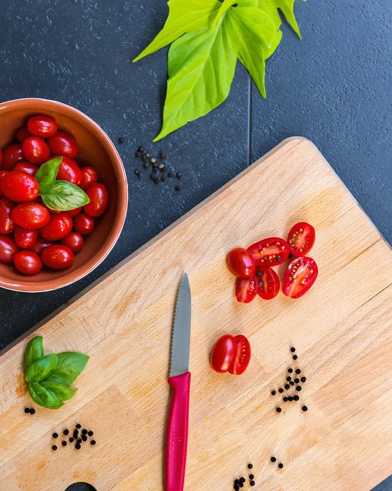 Grape tomatoes organic cutting board